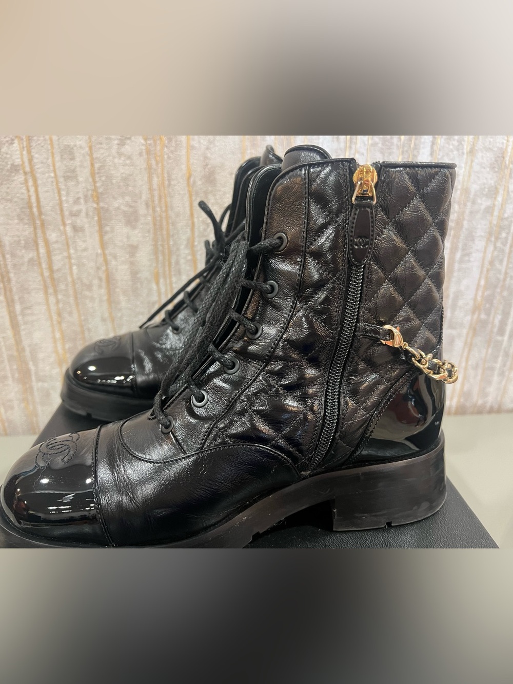 CHANEL Black Quilted Leather Combat Boots with Gold Chain Accent